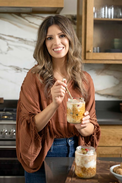 Christine posing for the camera holding overnight oats