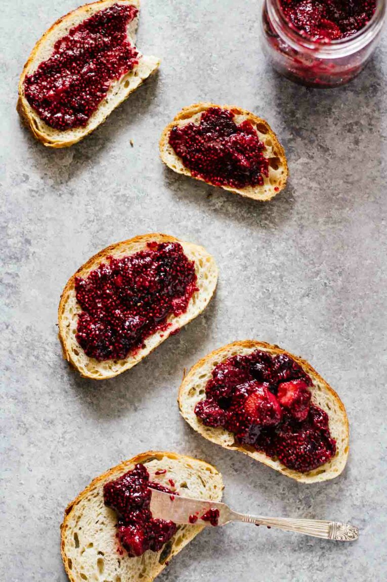 An overhead shot of chia seed jam on slices of bread