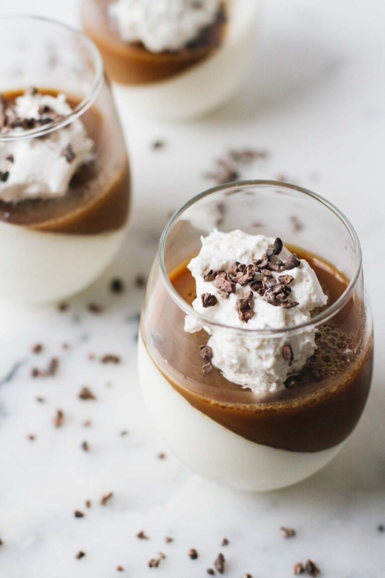 Delicious Coffee Panna Cotta in a glass on a white surface
