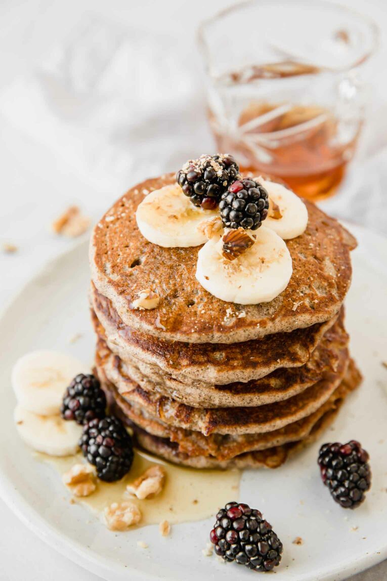 A stack of pancakes on a plate.