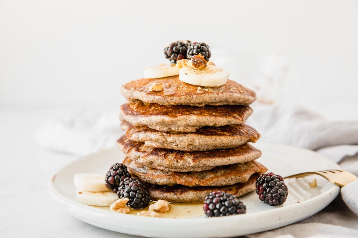 A stack of Buckwheat Pancakes on a white plate