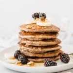 A stack of Buckwheat Pancakes on a white plate