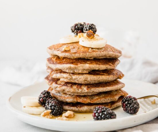 A stack of Buckwheat Pancakes on a white plate