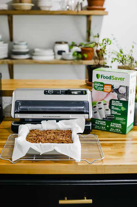FoodSaver with pecan pie bars in a baking dish.