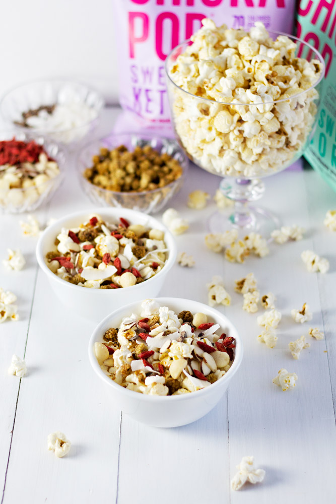 Across photo of popcorn party mix on a table.