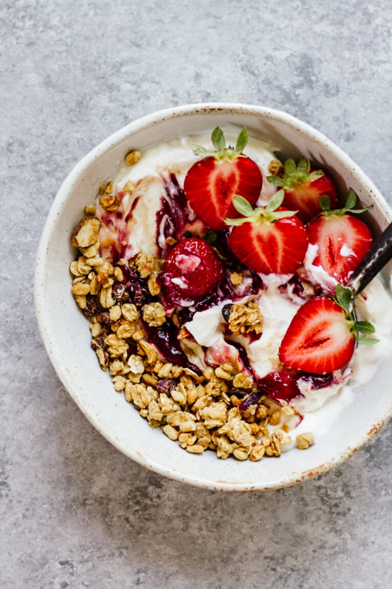 Overhead shot of Peanut Butter & Jelly Yogurt Bowl with a spoon