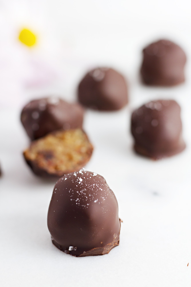 A close up of Healthy Salted Caramel Truffles topped with salt