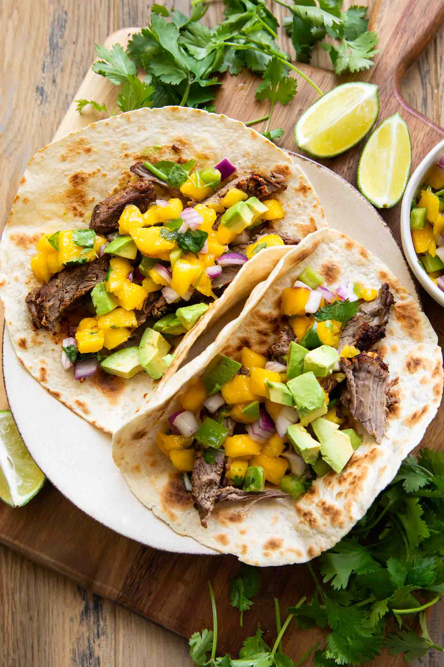 Slow Cooker Chili Lime Beef Tacos w/ Mango Salsa!