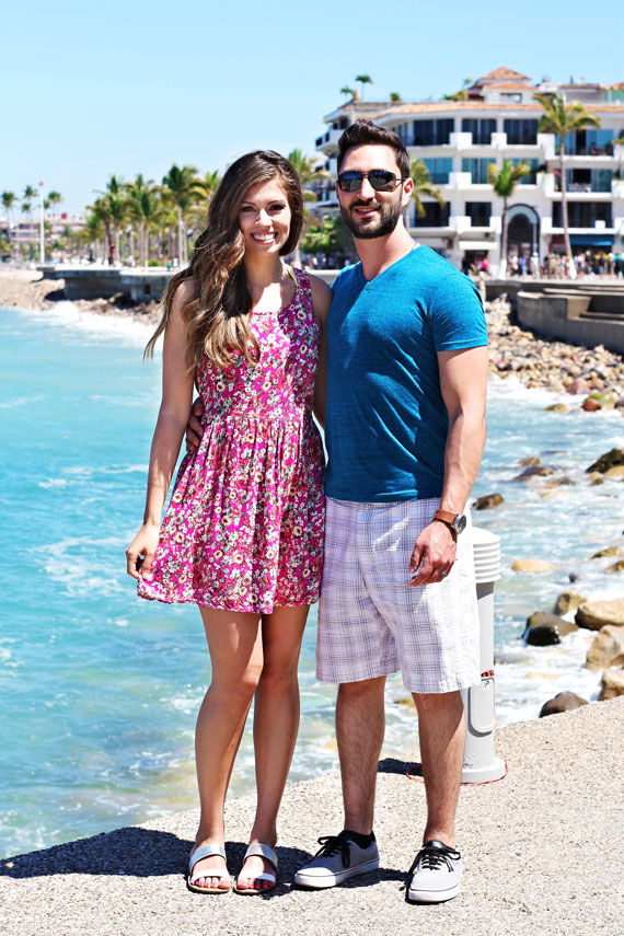 picture of man and woman standing in front of a beach