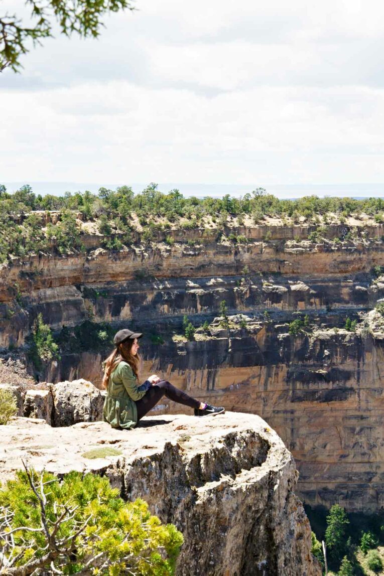 girl sitting on rock in Grand Canyon