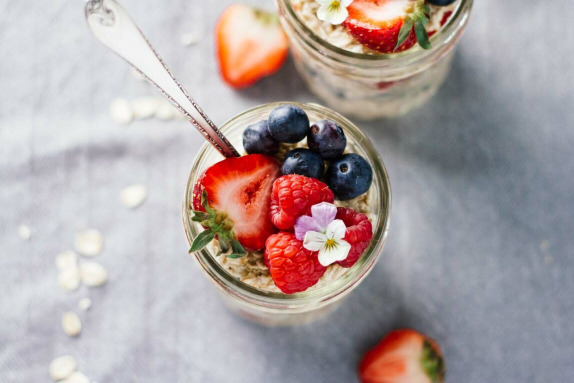 Triple Berry Overnight Oats in a mason jar