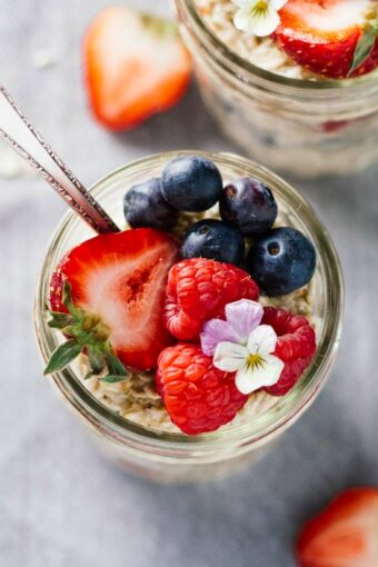 Triple Berry Overnight Oats in a mason jar
