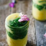Kiwi smoothie in a mason jar with pineapple, turmeric, and healthy ingredients.