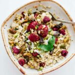 Homemade muesli in a white bowl with a spoon