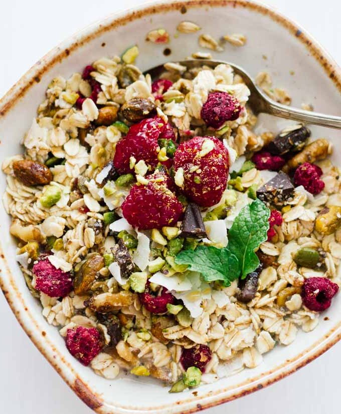 Homemade muesli in a white bowl with a spoon
