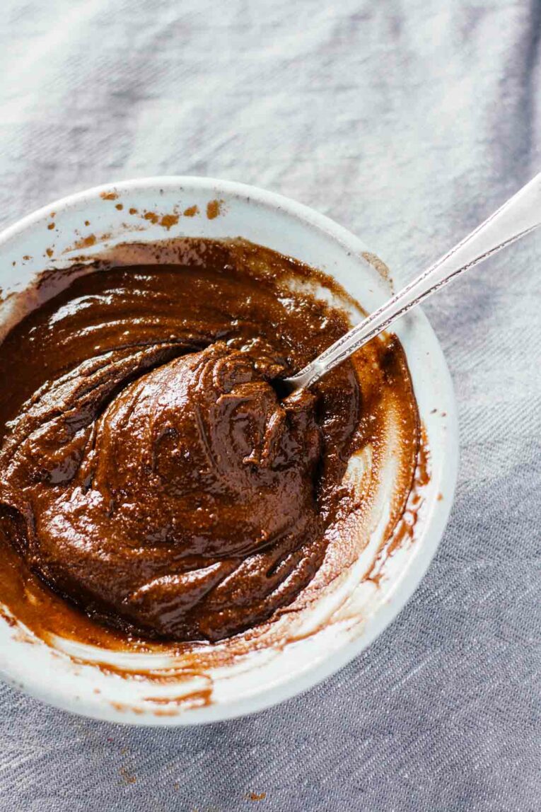 bowl of melted chocolate with spoon