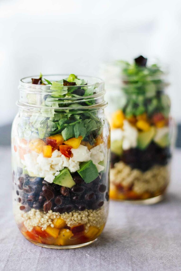 Central American Salad in two jars with a white background.