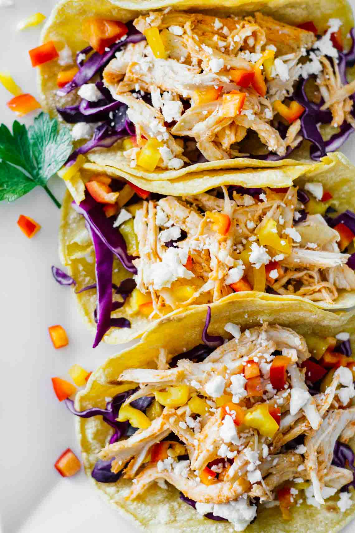 Healthy Sriracha Shredded Chicken Tacos! YUM! Perfect for a quick and easy weeknight meal.
