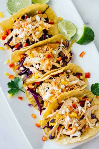 Healthy Sriracha Shredded Chicken Tacos! YUM! Perfect for a quick and easy weeknight meal.