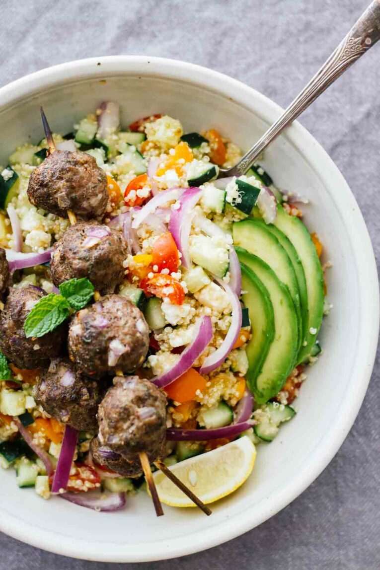 Mediterranean Salad Bowls w/ Lebanese BBQ Meatballs served in a bowl with a fork
