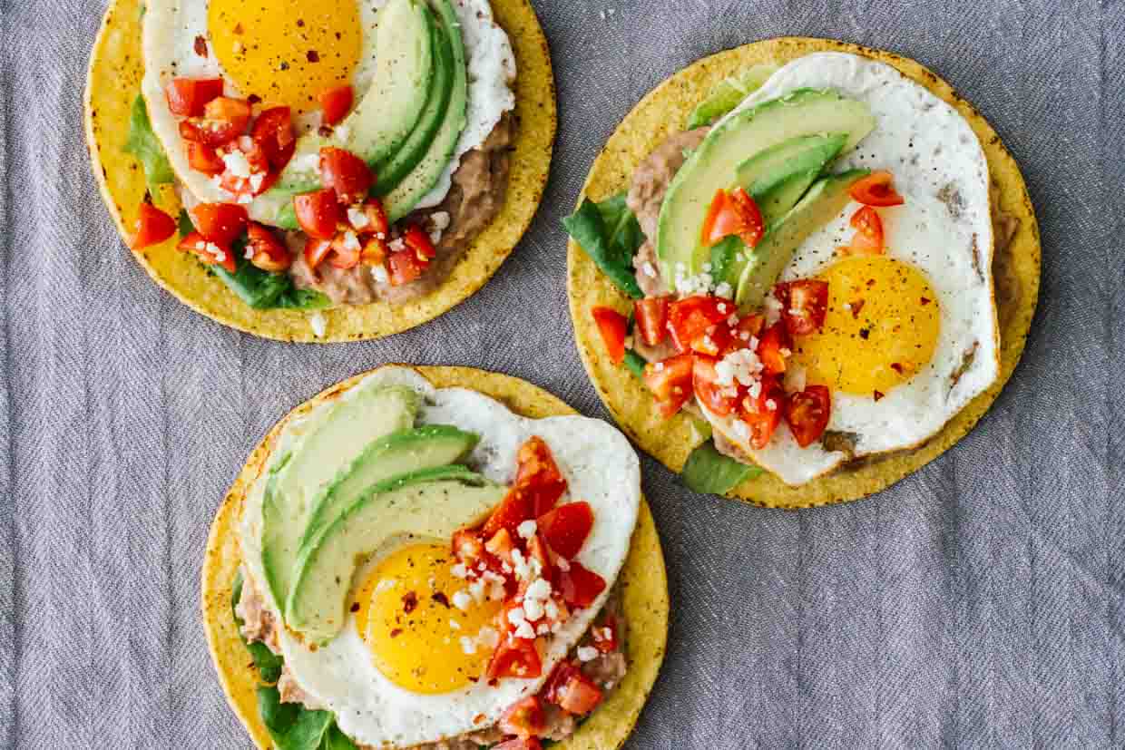 An overhead shot of 3 Huevos Rancheros Breakfast Tostadas!