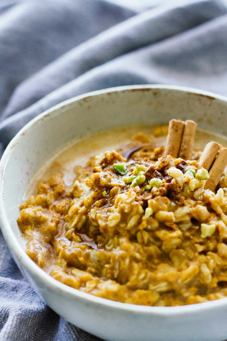 A close up of Pumpkin Oatmeal topped with nuts