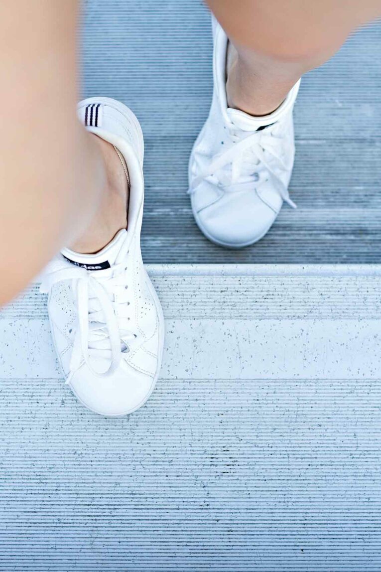 picture of white workout shoes climbing bleachers