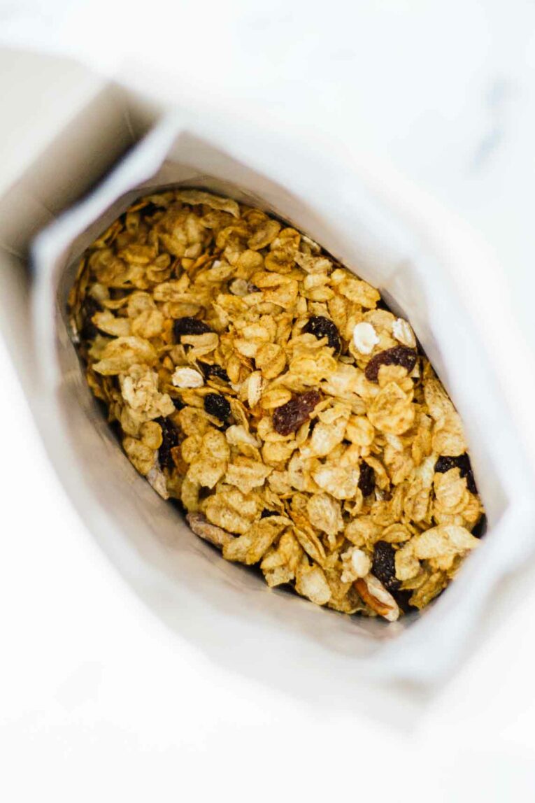 An overhead shot of an open box of cereal used for topping acai bowls