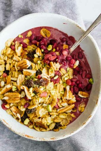An overhead shot of an acai bowl with a spoon