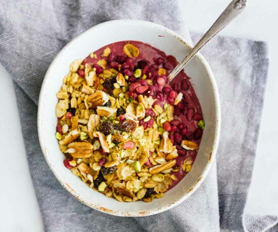 An overhead shot of an acai bowl with a spoon