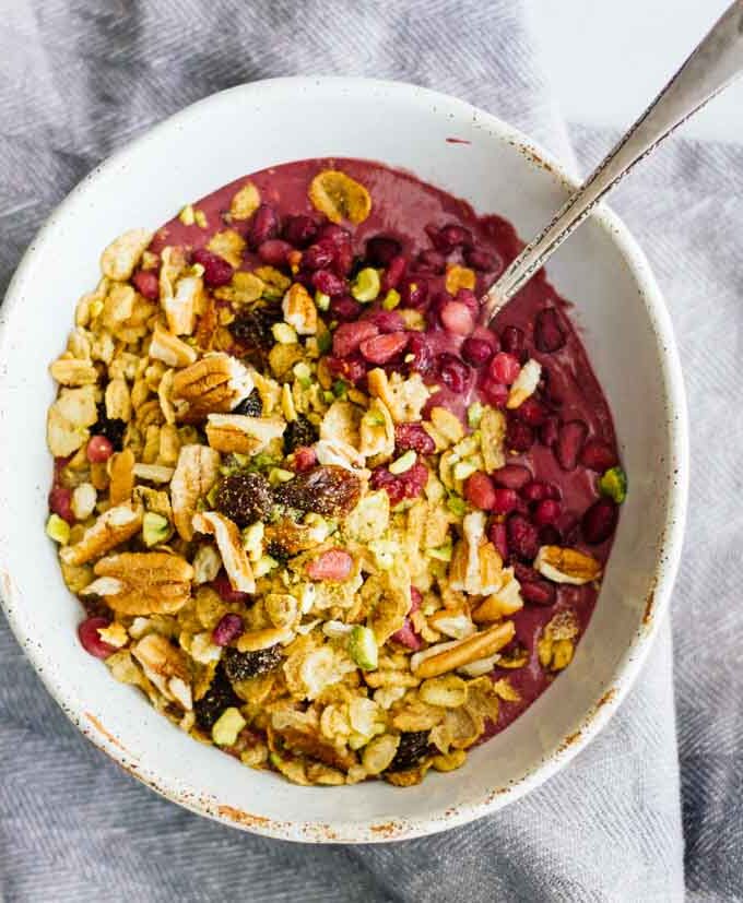 An overhead shot of an acai bowl with a spoon