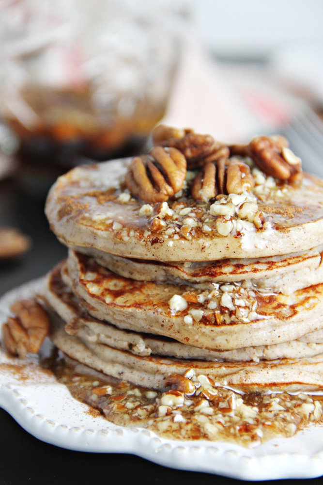 Stack of Pecan Pie Pancakes on a white plate.