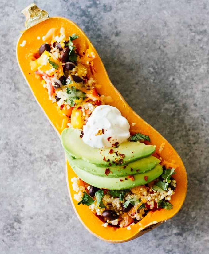 Mexican Quinoa Stuffed Butternut Squash! Vegetarian, gluten-free, easy to make. Perfect for a simple and healthy weeknight meal!