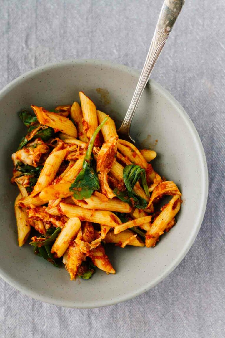 One-Pot Basil Chicken Baked Ziti in a bowl with a fork