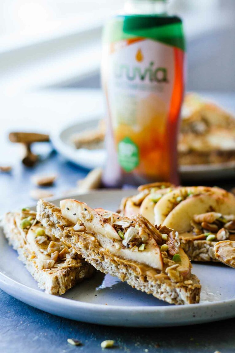 Apple Cinnamon Peanut Butter Breakfast Toast GOODNESS! This super easy recipe is great for a quick and healthy breakfast, pre-workout, or post-workout meal! #Jaroflemons #peanutbutter #healthybreakfast Slices of Apple Cinnamon Peanut Butter Breakfast Toast on a plate