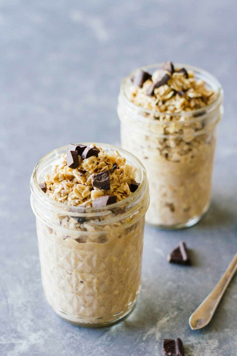 Mocha Latte Overnight Oats in two mason jars topped with chocolate chunks