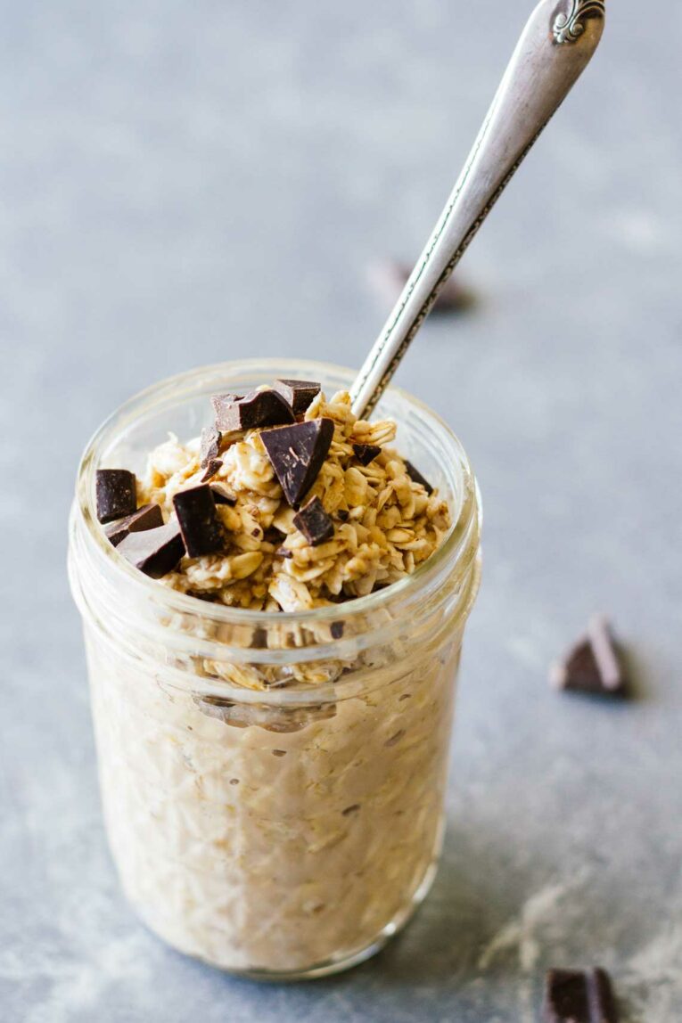 Mocha Latte Overnight Oats in a mason jar with a spoon.