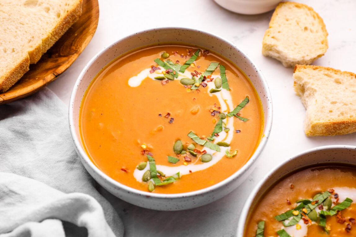 overhead shot of Pumpkin Curry Soup on grey background
