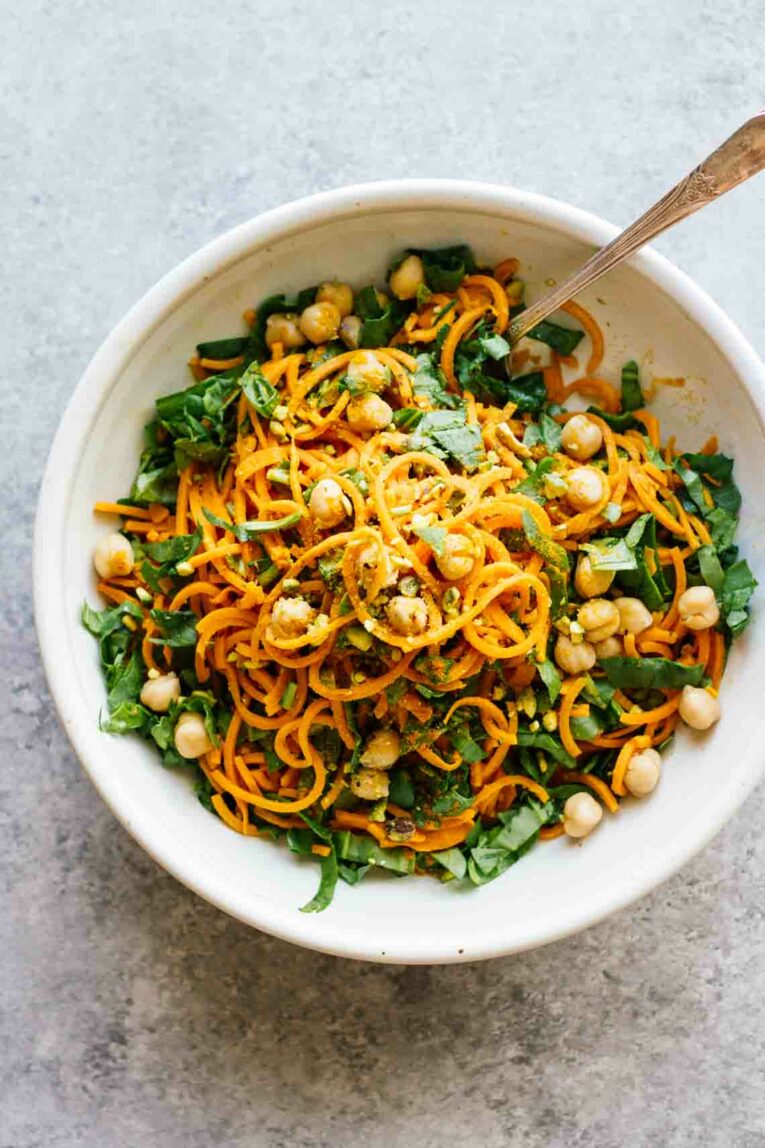 Turmeric Sweet Potato Pasta Salad in a white bowl with a fork