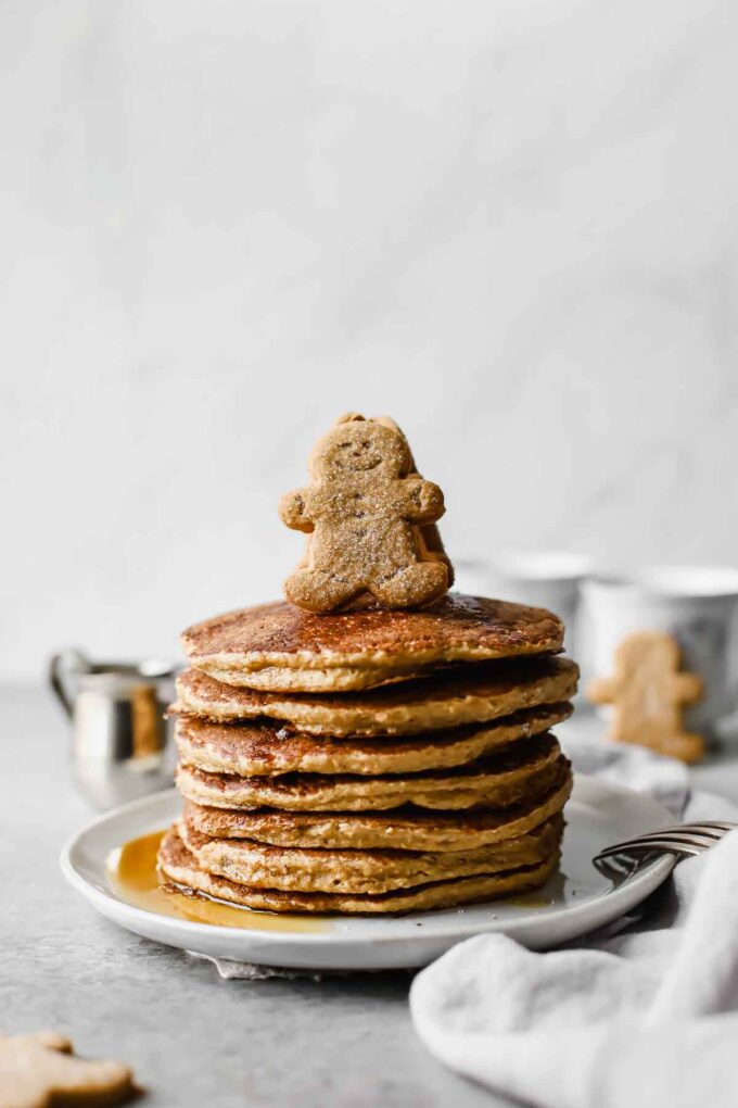 Sweet, wholesome, Healthy Gingerbread Oatmeal Pancakes Recipe that's perfect for this holiday season! Made with rolled oats, yogurt, and banana (gluten free). Serve for holiday brunch or freeze for easy breakfast meals throughout the week!