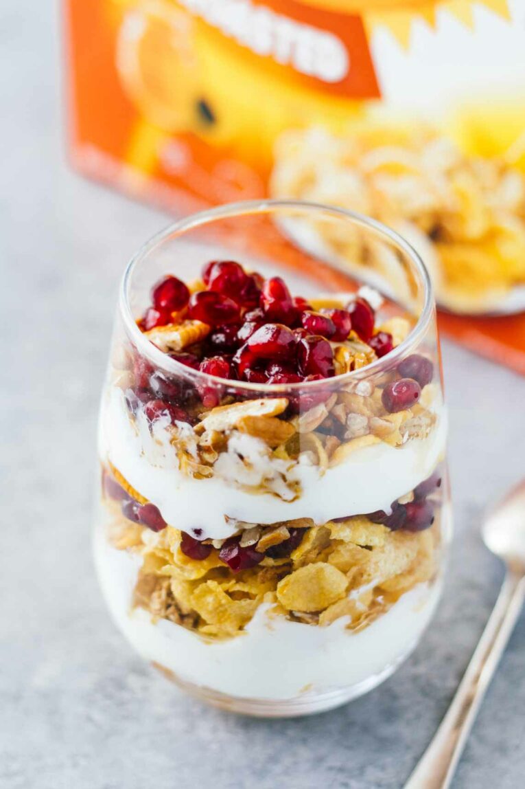 A close up of a Pomegranate Pecan Breakfast Parfait in a glass