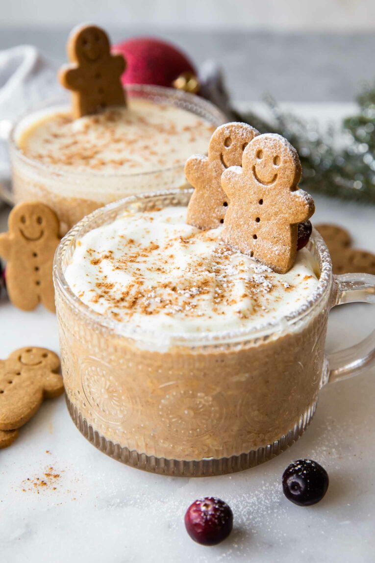 Gingerbread Cookie Overnight Oats in a mason jar topped with a gingerbread cookie