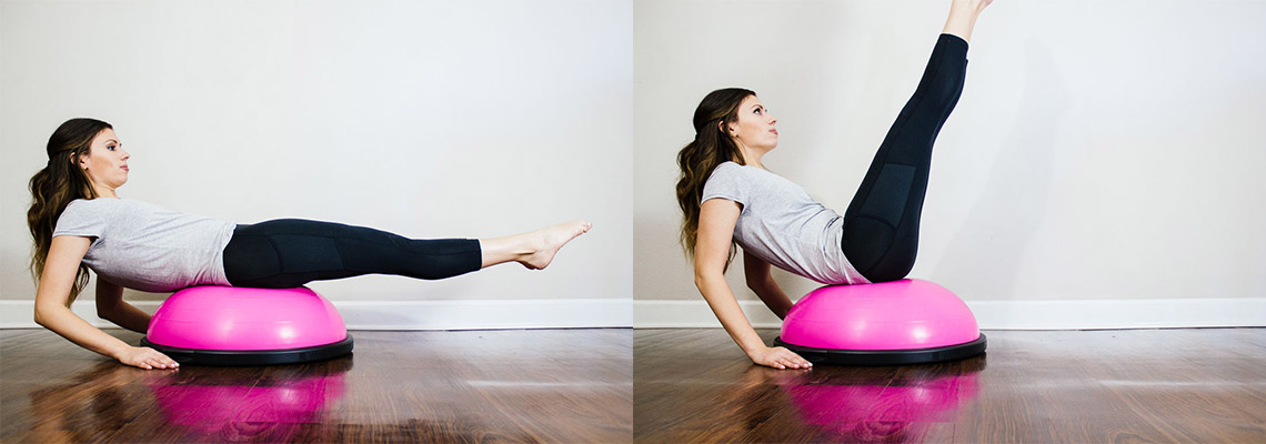 girl doing leg lifts on a workout ball