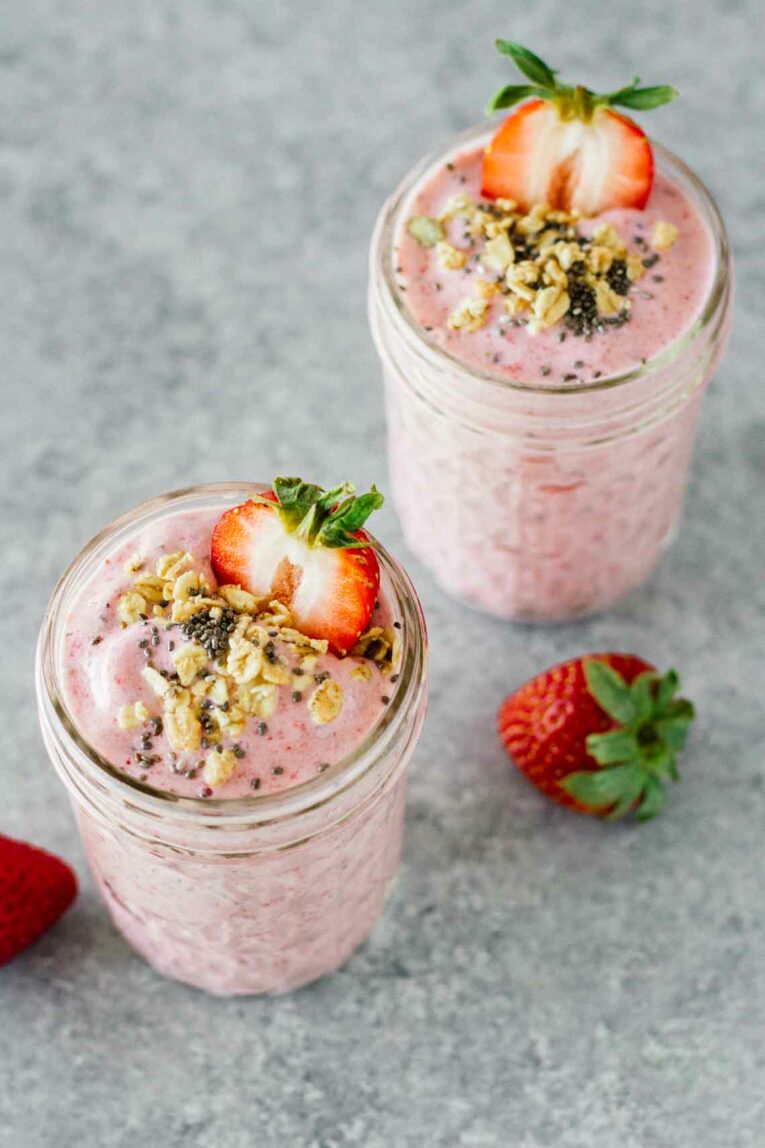 2 mason jars with Strawberry Banana Chia Seed Smoothies.