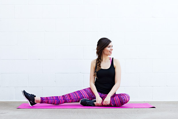girl doing pose on a purple yoga mat
