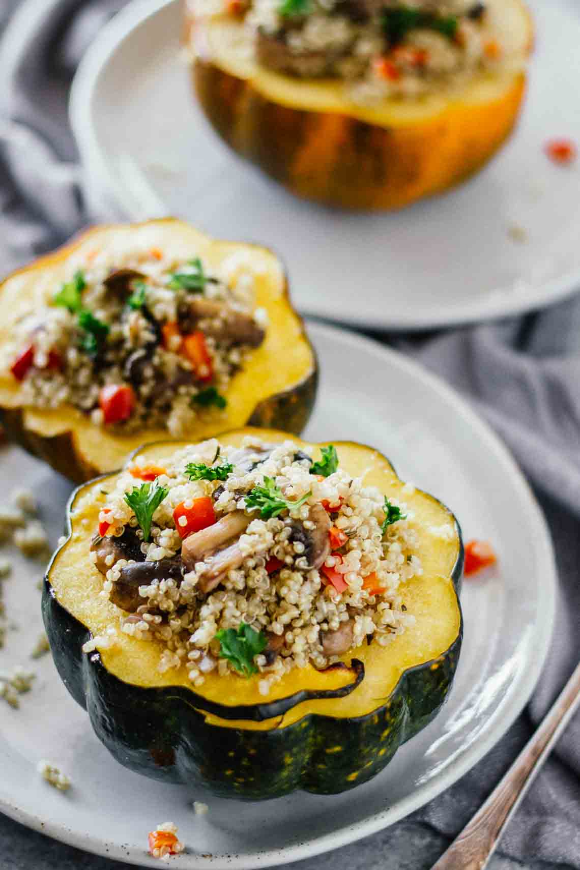 Quinoa & Mushroom Stuffed Acorn Squash! Gluten-free, vegan, and vegetarian. Super easy to make!