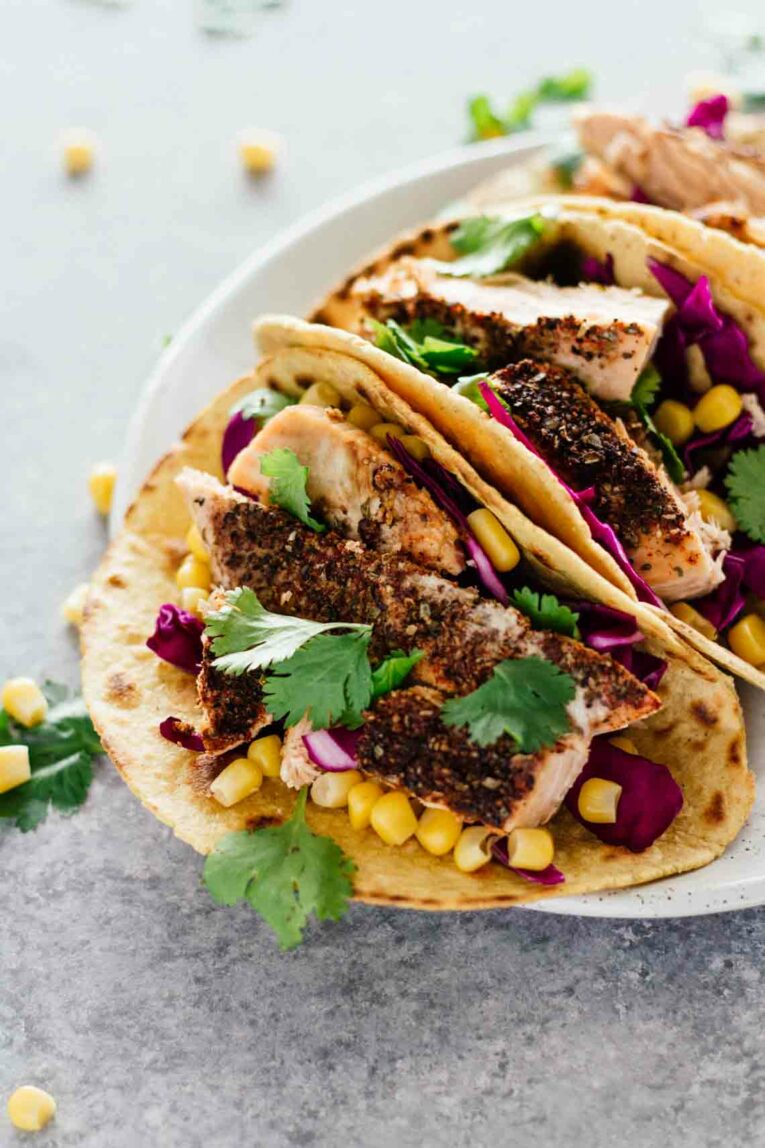 30-Minute Blackened Salmon Tacos served on a white plate