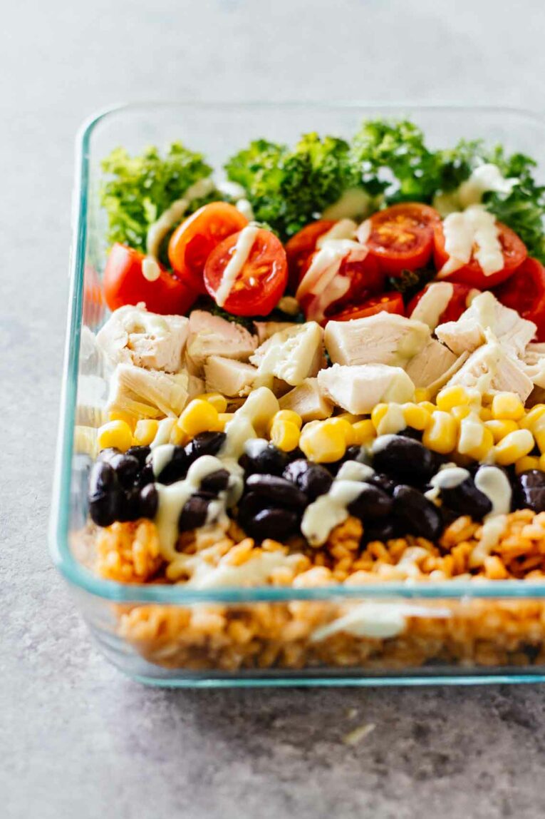 meal prep southwest burrito bowls in a glass dish.