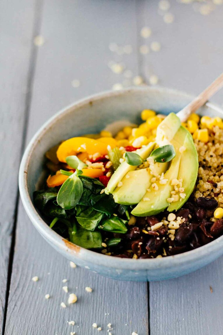  Black Bean Quinoa Bowls served in a bowl with a fork
