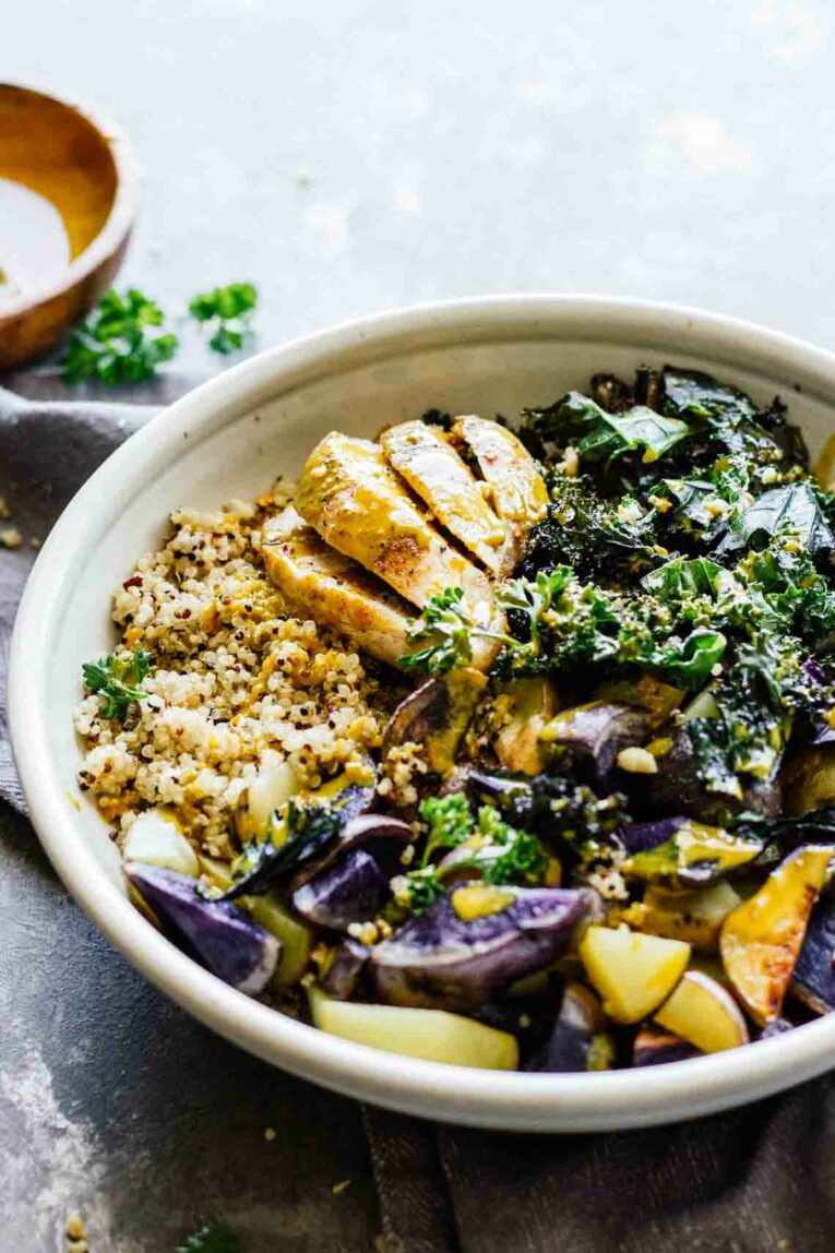 Baked Chicken with Turmeric Sauce served in a white bowl